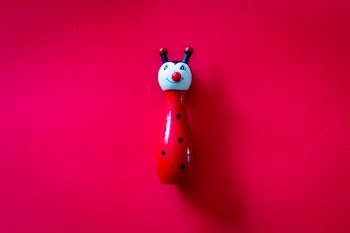 Red and Blue Ceramic Figurine
