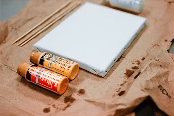 Red and Brown Plastic Bottles on Table