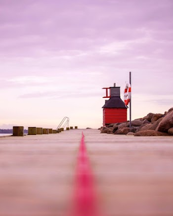 Red and Gray Structure Beside Dock