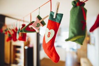 Red and Green Christmas Stocking Hanging Inside Room