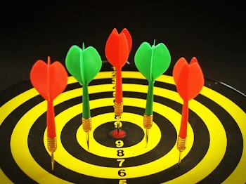 Red and Green Dart Pins on Dart Board