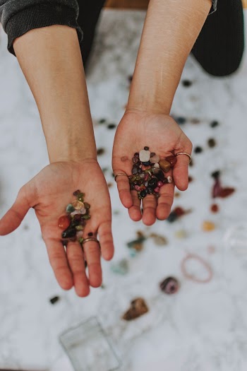 Red and Green Fruits on Persons Palm