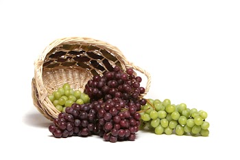 Red and green grapes in basket