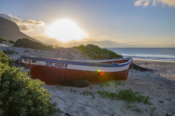 Red and White Boat Near Seashore