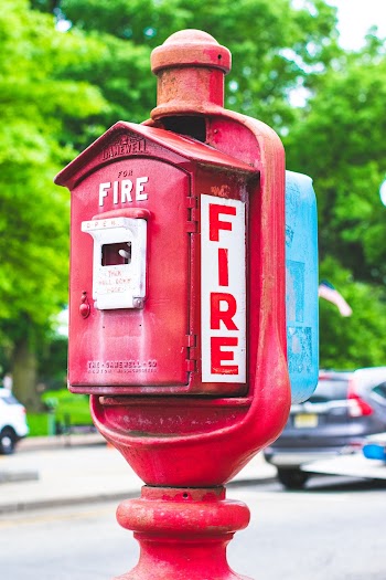 Red and White Fire Metal Container
