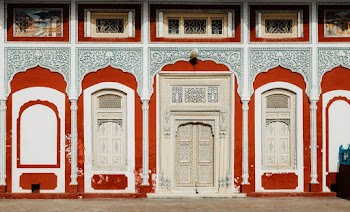 Red and White-framed Beige Doors