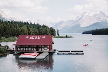 red and white house on body of water
