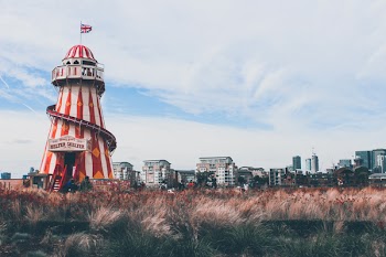 Red And White Tower Beside Field