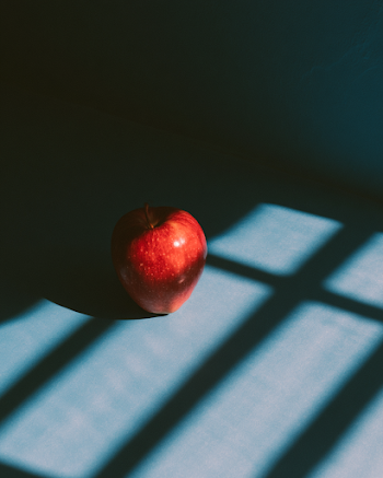 Red Apple on Vibrant Blue Background