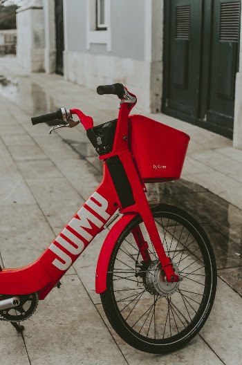 Red Bicycle Parked Near Door