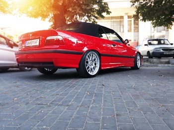 Red Bmw Coupe Parked on Road