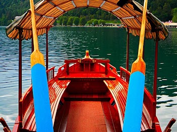 Red Boat on Body of Water