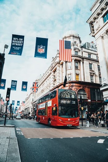 red bus in city street