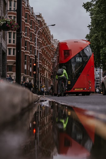 Red Bus Passing Through Building