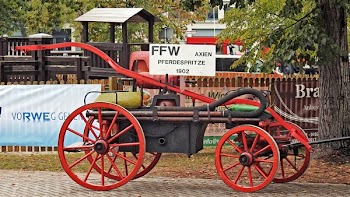 Red Carriage Along Street