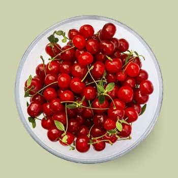 Red cherries on a plate, | Free PSD - rawpixel