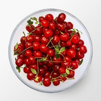 Red cherries on a plate, | Free PSD - rawpixel