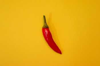 Red Chili on Yellow Surface