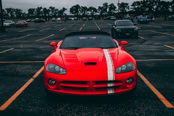 Red Convertible Coupe on Black Surface