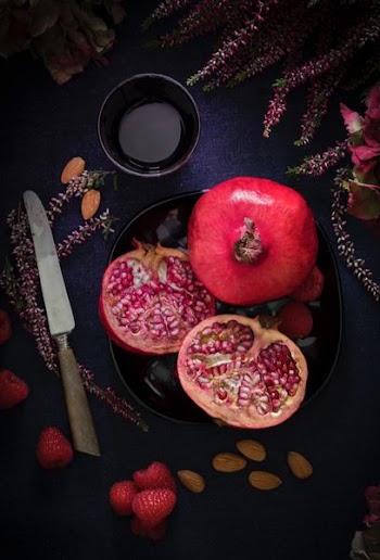 red fruit on black plate