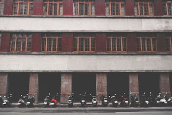 red, gray, and brown painted wall building taken at daytime