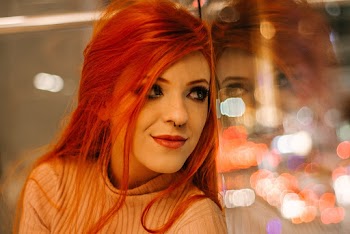 Red Haired Woman in Beige Sweater
