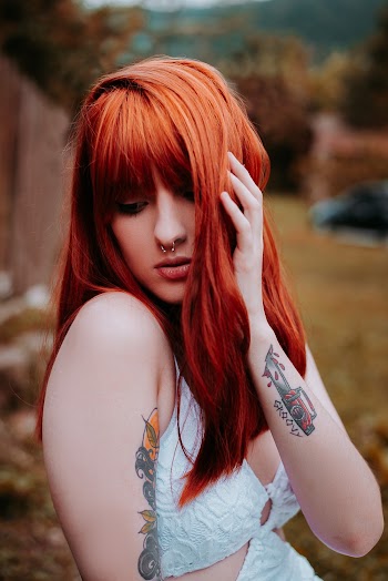 Red Haired Woman With Tattoo