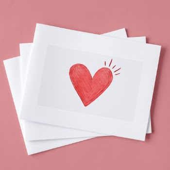 Red Heart Drawed White Printer Paper on Pink Surface