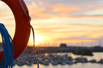 Red Life Ring With Rope during Golden Hour