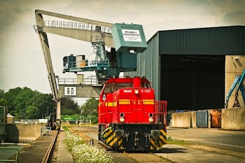Red Mak Train on Brown Train Tracks