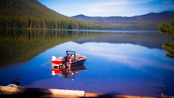Red Motorboat on Body of Water