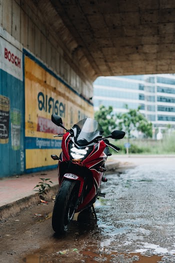 Red Motorcycle Under Overpass