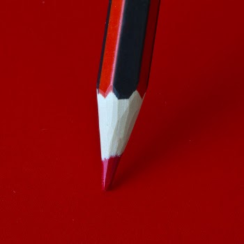 Red Pencil on a Red Surface