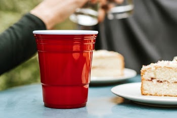 Red plastic cup by on a tabele | Free Photo - rawpixel