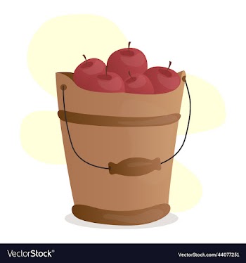 red ripe apples in a wooden bucket with a handle