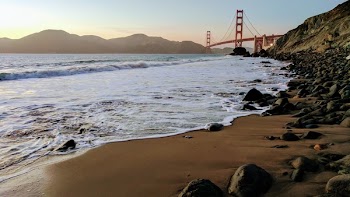 Red Steel Bridge over Calm Sea