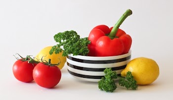 Red Tomato Green Broccoli Red Bell Pepper and Yellow Lime