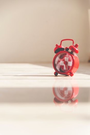 red twin bell alarm clock