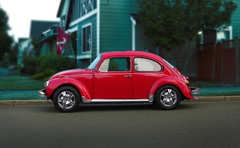 Red Volkswagen Beetle On Road