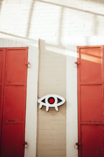Red Wooden Door on White Wall · Free Stock Photo