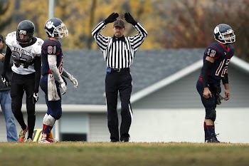 Referee Between 3 Football Player
