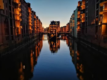 Reflection Of Building On Body Of Water