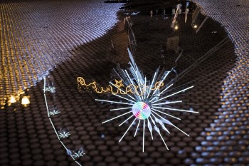 Reflection of Christmas Lights in Puddle