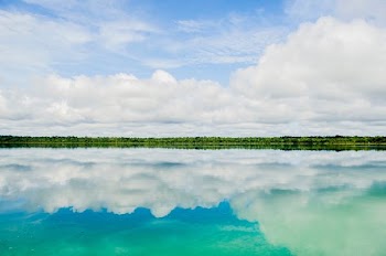 reflection of clouds in body of water