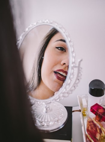 Reflection Of Face On Mirror