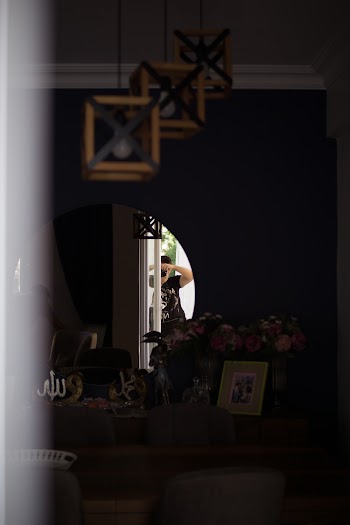 Reflection of Man Taking Photo