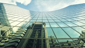 Reflection of other buildings on High-rise Glass Building