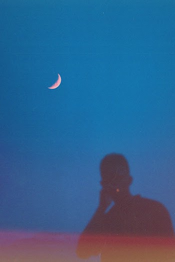 Reflection of Person Under Moon