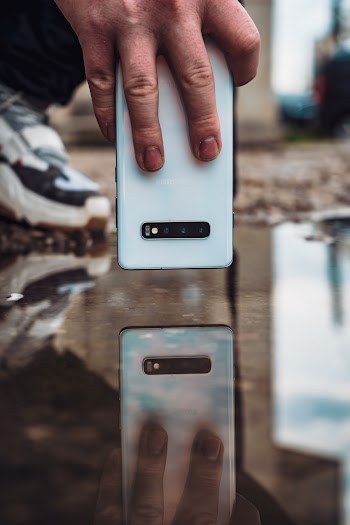 Reflection of White Smartphone on Water