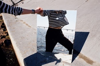 Reflection of Woman Wearing Black Pants 